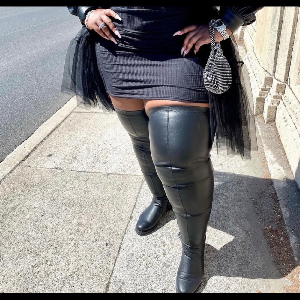 Thigh high faux leather wide calf stretch boot. Black size 12